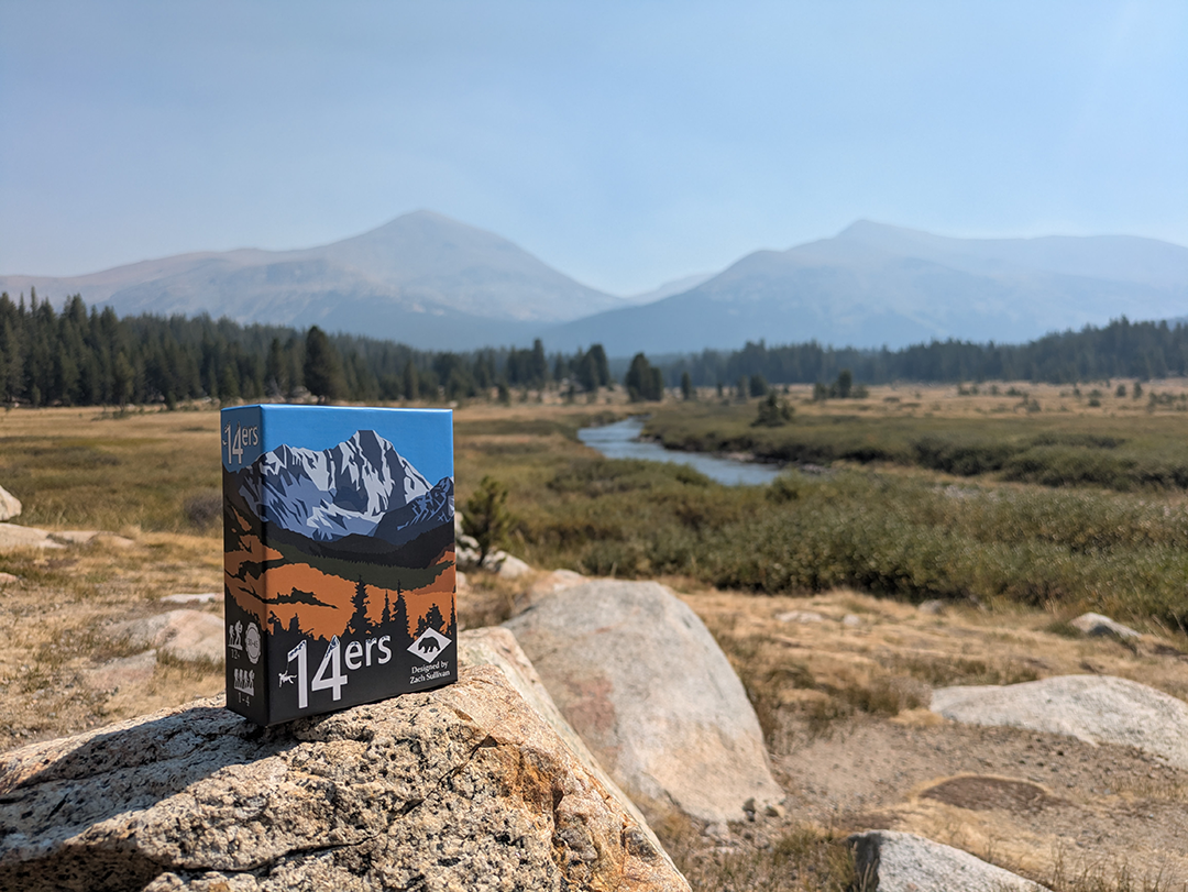 Promo image of the 14ers box in a mountain landscape